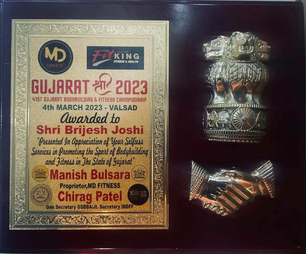 Gujarat Shri 2023 award plaque presented to Shri Brijesh Joshi at the 41st Gujarat Bodybuilding and Fitness Championship, Valsad