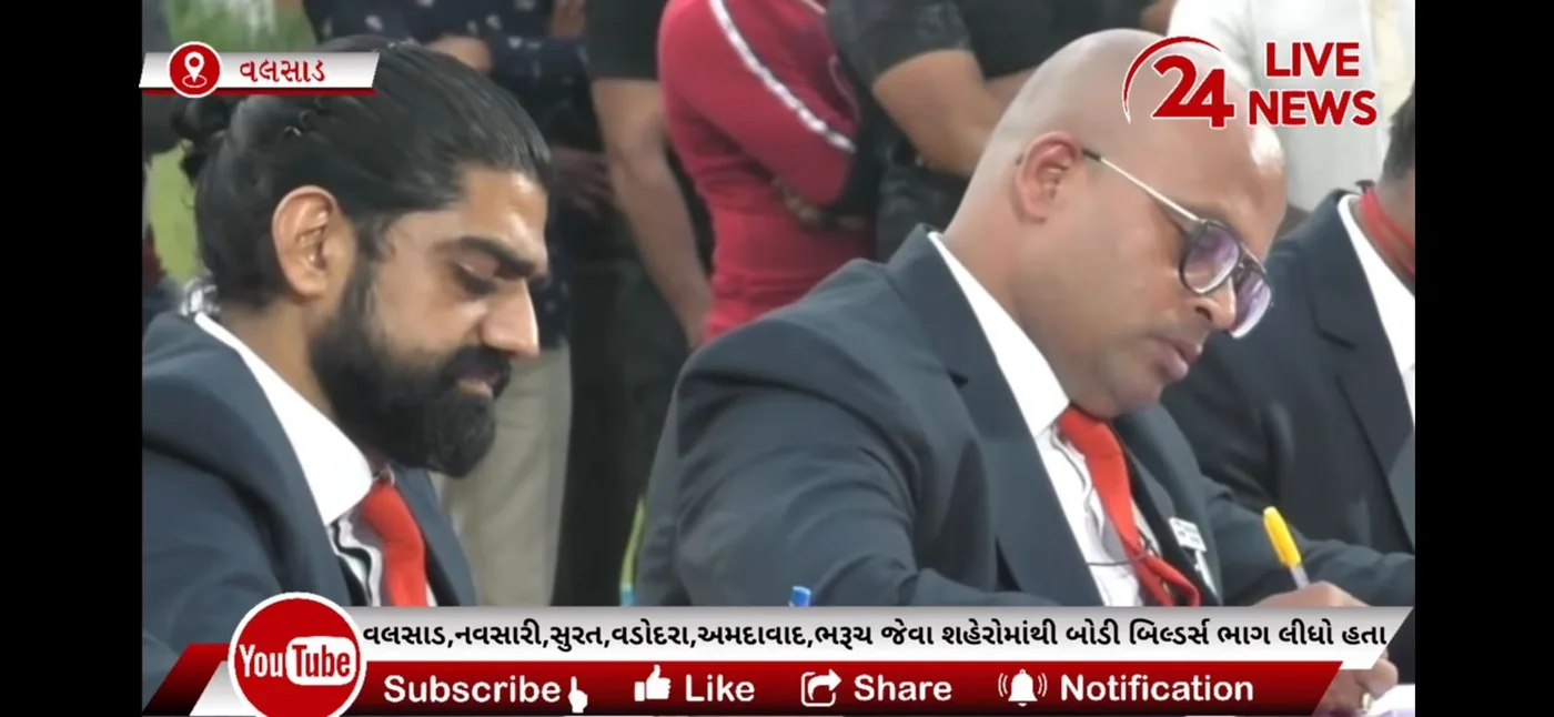 Television coverage of a bodybuilding championship in Valsad showing Brijesh Joshi among the judges