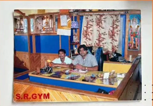 The original S.R. Gym reception desk photographed in 1999, with the S.R. GYM sign visible
